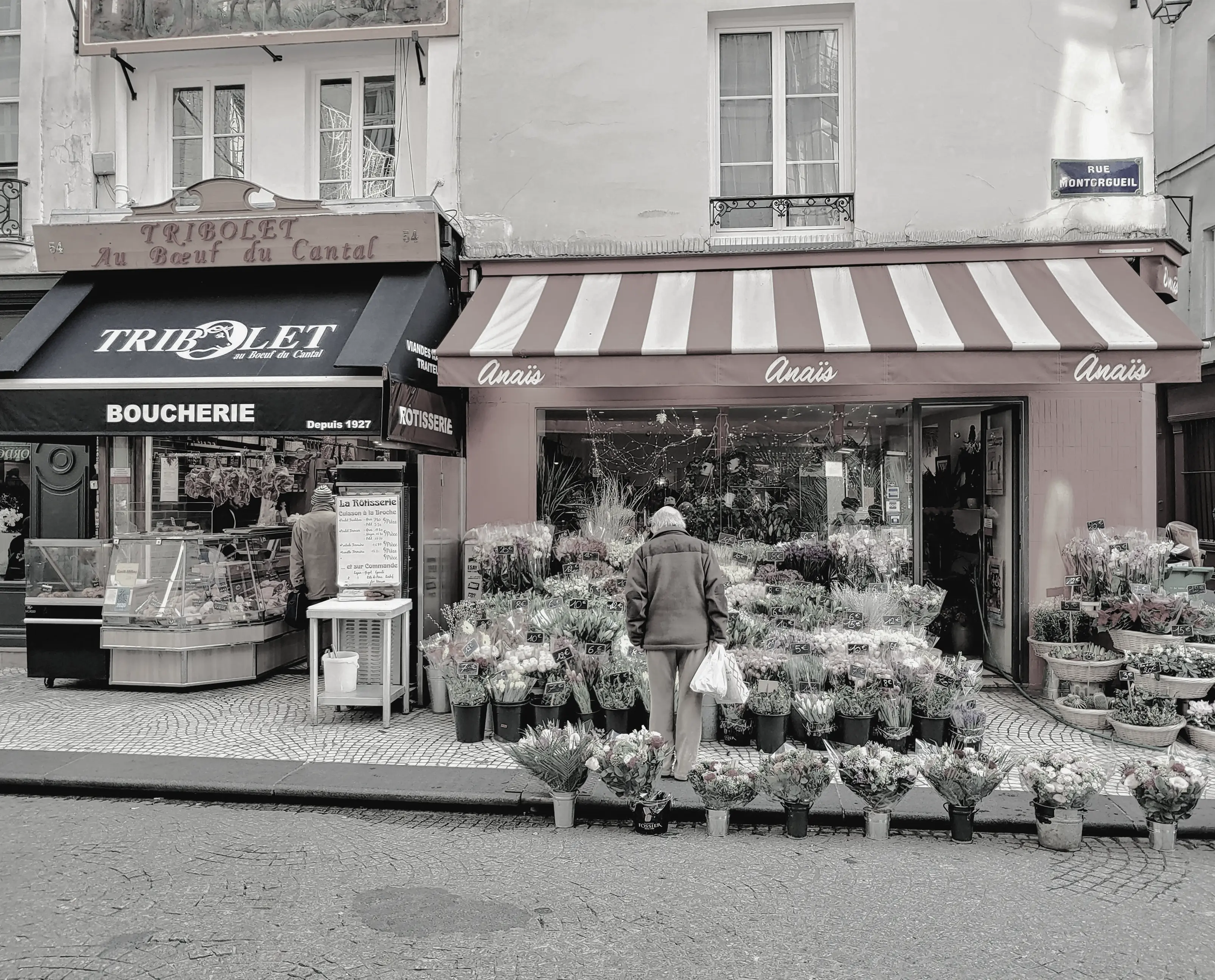 Butcher shop and florist storefronts side by side
